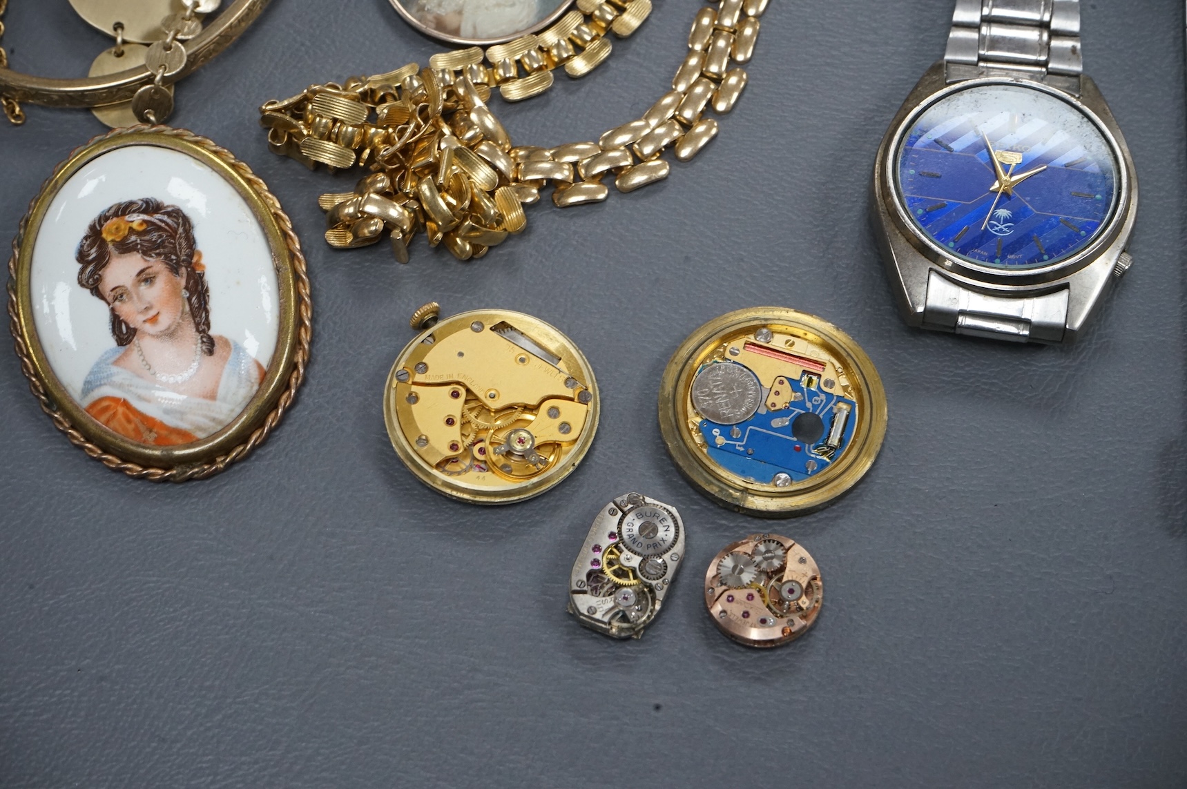 A quantity of assorted costume jewellery and other items including wrist watches, watch movements and a silver vesta case.